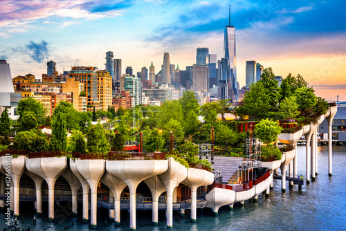 View of Lower Manhattan skyline at sunset, behind the Little Island public park.