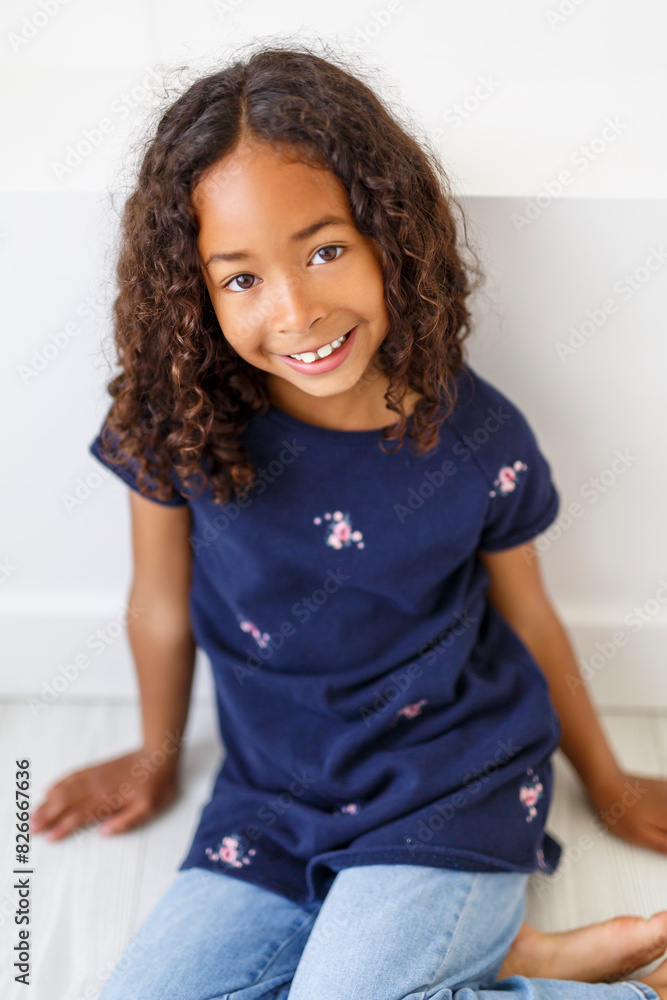 An Adorable black american little girl with beautiful hairstyle