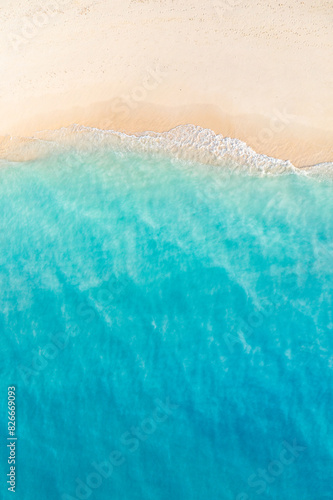 Summer seascape beautiful closeup. Blue sea water in sunny day. Top view from drone. Sea aerial surf, amazing tropical nature background. Mediterranean bright sea bay waves splashing beach sandy coast