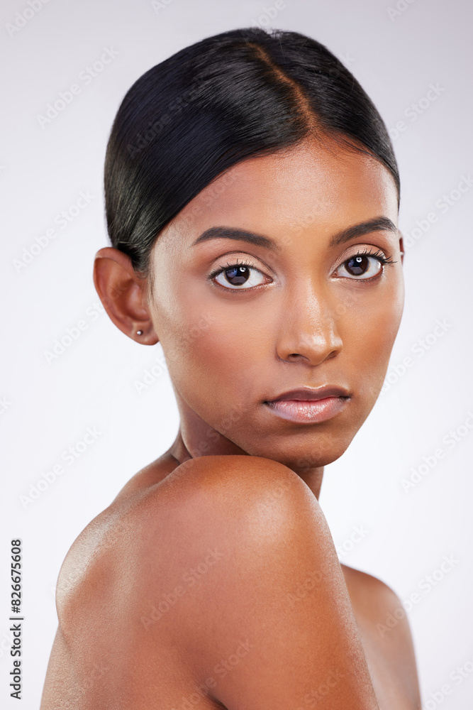 Portrait, skincare and face of woman in studio for wellness or dermatology with glow or shine. Cosmetic, serious and smooth healthy skin with treatment for hydration isolated on gray background. Portrait, skincare and face of woman in studio for wellness or dermatology with glow or shine. Cosmetic, serious and smooth healthy skin with treatment for hydration isolated on gray background.
