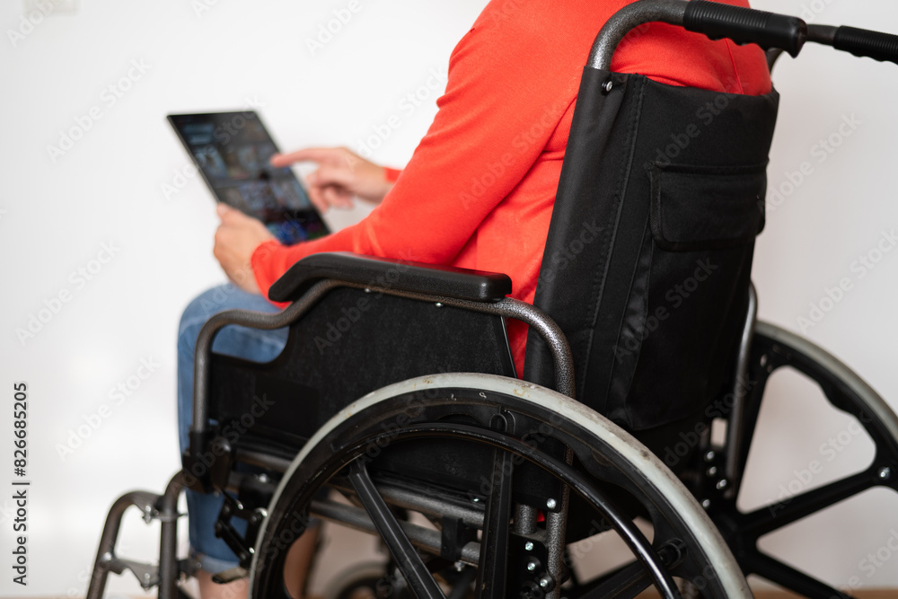 Disabled Person In Wheelchair On White Background Searching For Movies Or Television Series To Watch For Pleasure. Woman Choosing Movies On Internet Streaming Service. Disabled Person In Wheelchair On White Background Searching For Movies Or Television Series To Watch For Pleasure. Woman Choosing Movies On Internet Streaming Service.