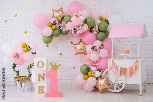 Pink decor with flowers for first birthday