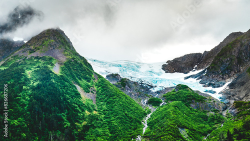 Summer glacier in the mountains with lush greenery in alaska