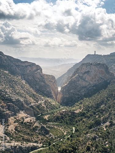 An overlook aerial view of the El Caminito Del Rey hiking route in the canyon of the Guadalhorce river, as seen from the Mirador De Las Buitreras lookout point photo