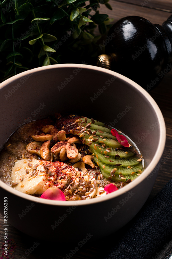 Raw linen cereal with fruits, nuts in bowl. Super food for healthy nutritious breakfast Raw linen cereal with fruits, nuts in bowl. Super food for healthy nutritious breakfast