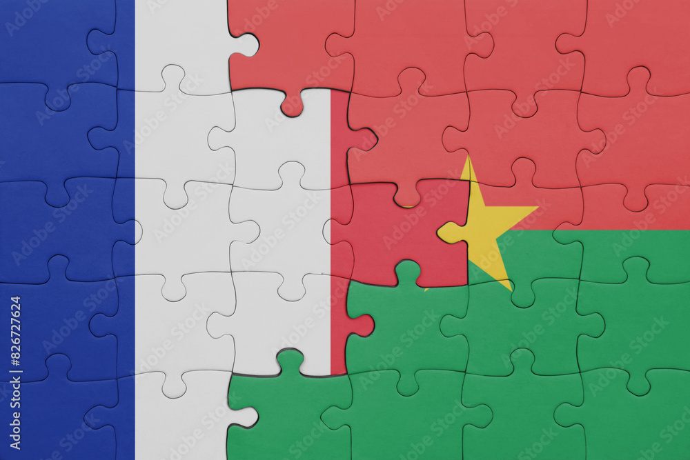 puzzle with the colourful national flag of burkina faso and flag of france. puzzle with the colourful national flag of burkina faso and flag of france.