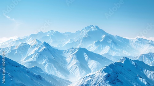 Landscape view of snow-capped mountains under a clear blue sky