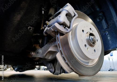 The brake disc and brake caliper are installed on the vehicle.