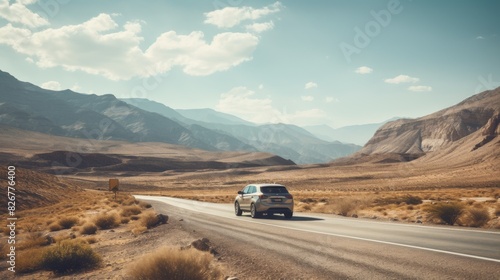Lone Car Traveling Through Desert Landscape On A Sunny Day. Generative AI © Svetlana