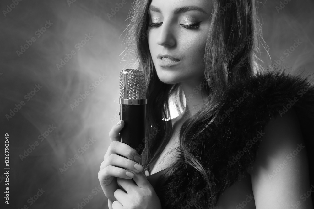 Beautiful singer with microphone, black and white effect Beautiful singer with microphone, black and white effect