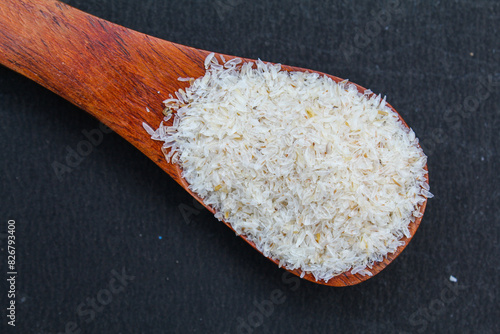 Billede på lærred Psyllium husk or isabgol husk on wooden spoon close-up view