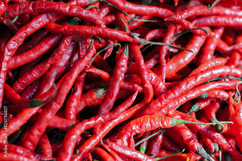 macro red chili,Red hot chili peppers pattern Chili texture background. Close up landscape background of hot chili peppers. Roadside vegetable market. Red chili group.