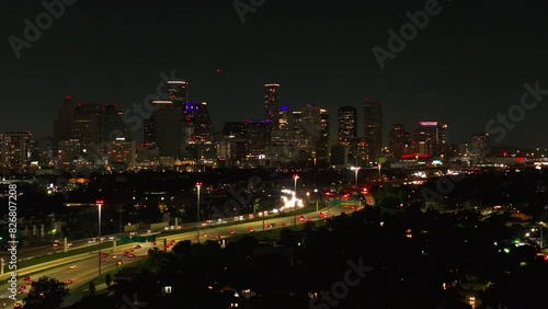 Wallpaper Mural Aerial view of Houston's bright skyline at night, showcasing skyscrapers and bustling highways with vibrant light trails. City's modern architecture and lively atmosphere in Texas Torontodigital.ca
