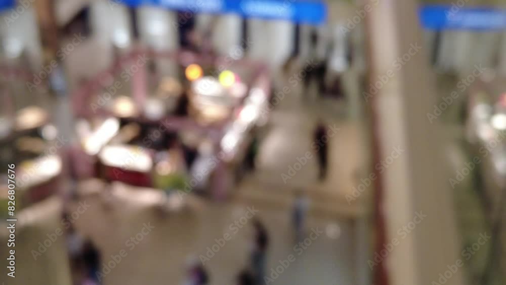 Blurred Motion of people in shopping center blur background Blurred Motion of people in shopping center blur background