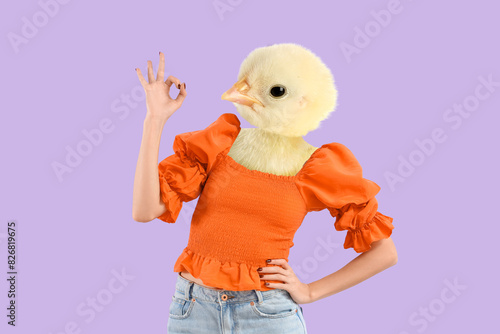 Young woman showing OK on l...
