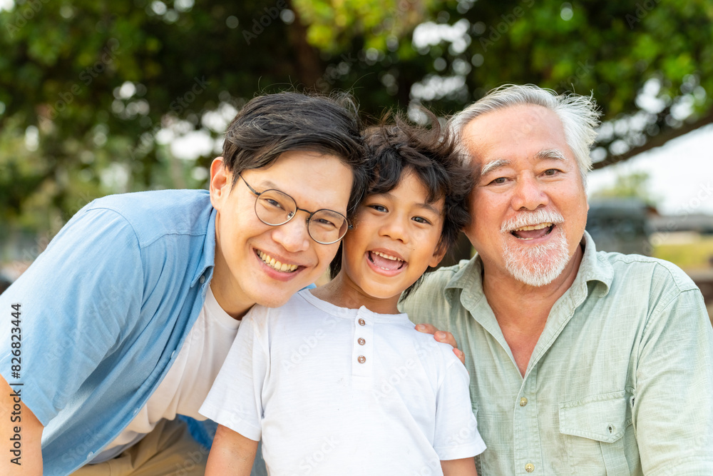 Portrait group of Happy Multi-Generation Asian men family enjoy and fun outdoor lifestyle walking and playing together at tropical beach at sunset during travel ocean on summer holiday vacation. Portrait group of Happy Multi-Generation Asian men family enjoy and fun outdoor lifestyle walking and playing together at tropical beach at sunset during travel ocean on summer holiday vacation.