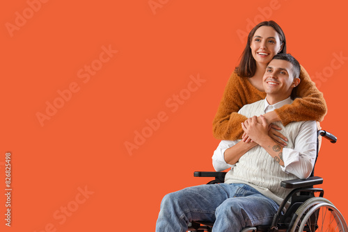 Young man in wheelchair and...