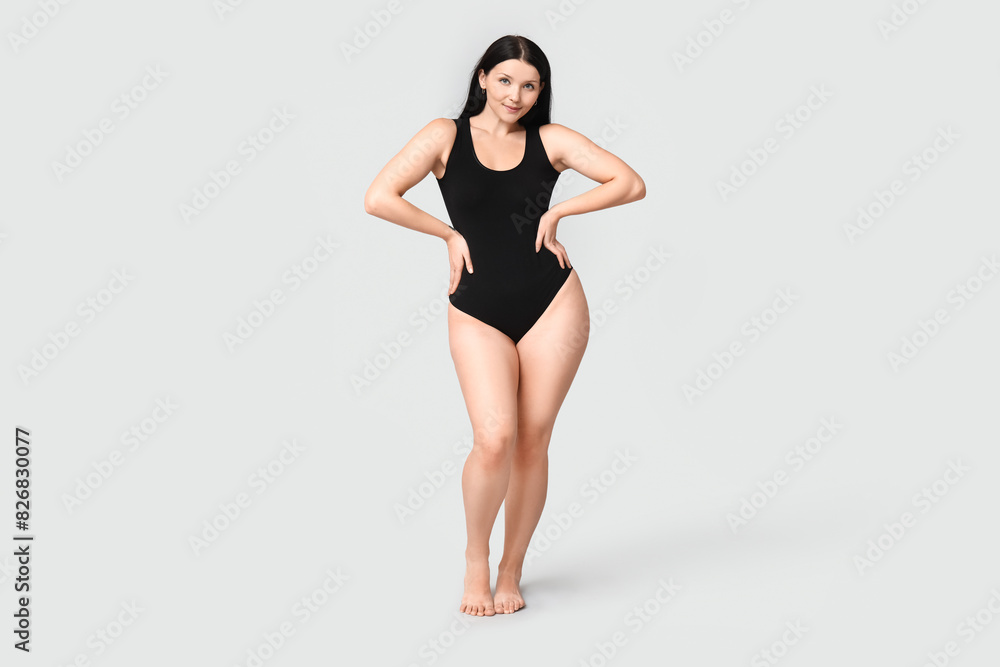 Body positive young woman on light background Body positive young woman on light background