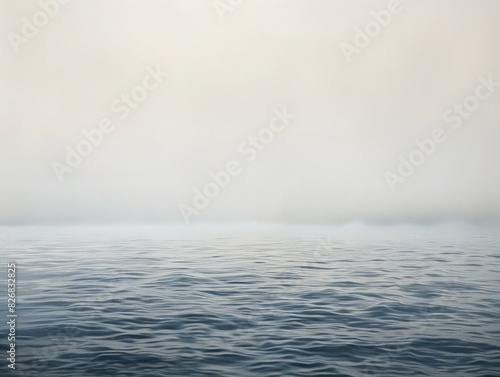 Foggy body of water shrouded in mist with emergent plant life. Moody, enigmatic landscape photo
