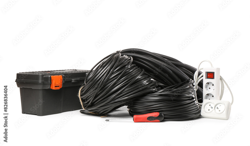 Rolled cables, flexible conduit tube, tool box and extension cord on white background Rolled cables, flexible conduit tube, tool box and extension cord on white background