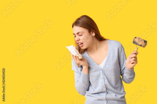 Young woman with tissue and...