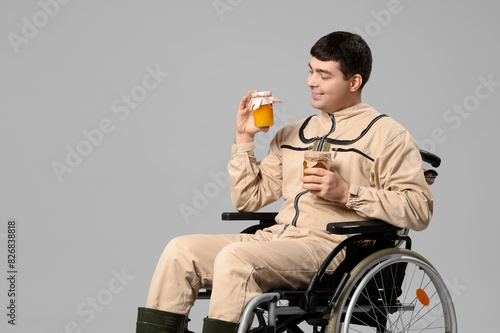 Male beekeeper in wheelchai...