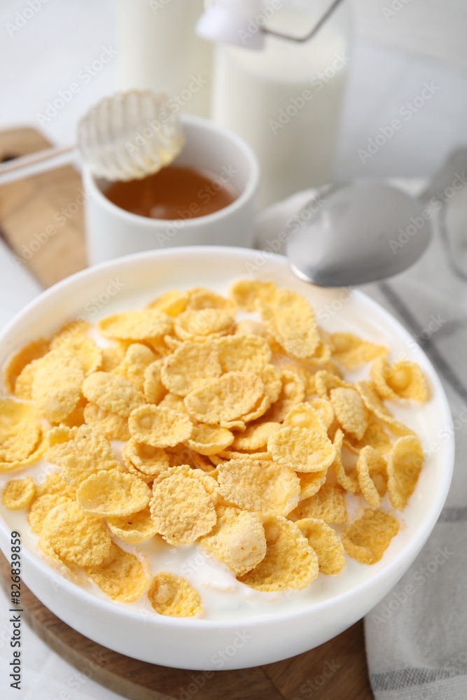 Breakfast cereal. Tasty corn flakes with milk in bowl on table Breakfast cereal. Tasty corn flakes with milk in bowl on table