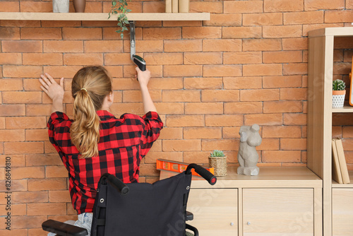 Young woman in wheelchair i...