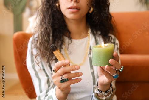Woman holding palo santo st...