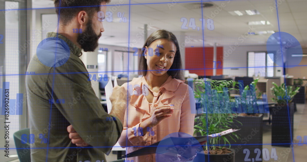 Image of statistical data processing over diverse man and woman discussing over a file at office Image of statistical data processing over diverse man and woman discussing over a file at office