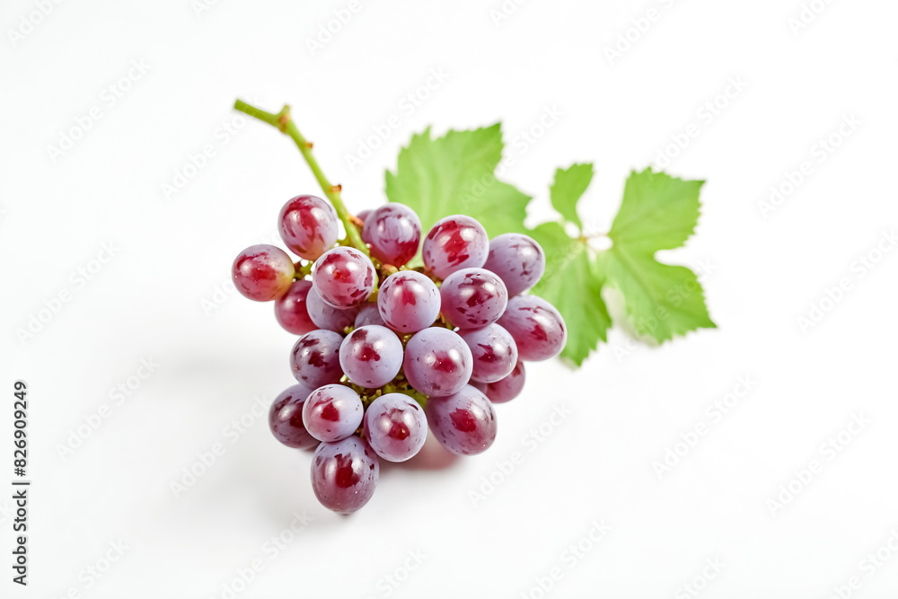 A bunch of red grapes with green leaves on a white background. A bunch of red grapes with green leaves on a white background.