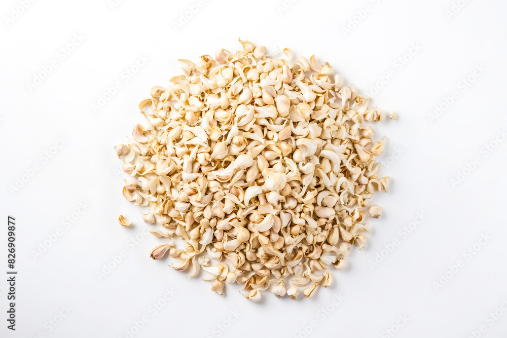 Top view of a pile of garlic cloves on a white background. Top view of a pile of garlic cloves on a white background.