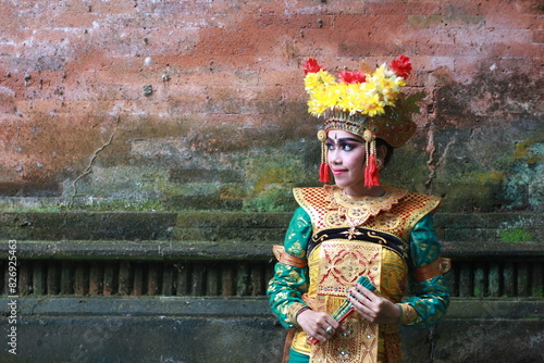 Legong is a refined and captivating dance form that holds a prominent position in Balinese classical dance traditions. Characterized by its intricate finger movements, graceful footwork, and expressiv photo