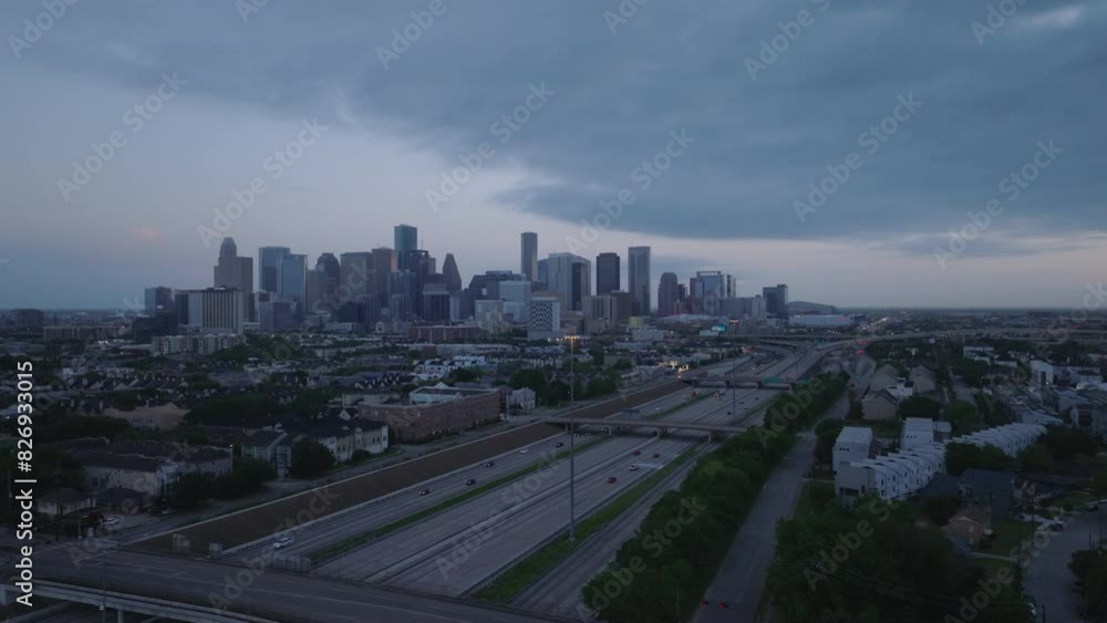 Aerial view of Houston's skyline at dusk, highlighting its iconic architecture and urban layout as the city shifts from twilight to night Aerial view of Houston's skyline at dusk, highlighting its iconic architecture and urban layout as the city shifts from twilight to night
