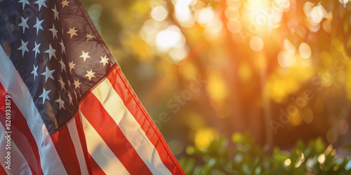 American flag waving in the wind with a warm sunset background creating a patriotic and inspiring atmosphere with soft bokeh lights 