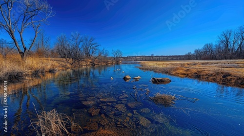 Early spring river under clear blue skies