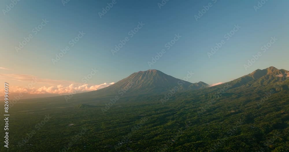 Agung volcano at dawn in Bali. Aerial view of ocean and mountain Agung volcano at dawn in Bali. Aerial view of ocean and mountain