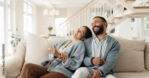 Happy couple, laughing and sofa for funny joke or humor bonding in home, marriage or living room. Man, woman and relationship conversation or apartment relax with boyfriend or together, house or chat