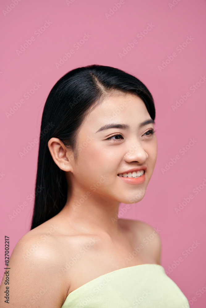 Natural beauty concept of a young Asian woman on a pink background Natural beauty concept of a young Asian woman on a pink background