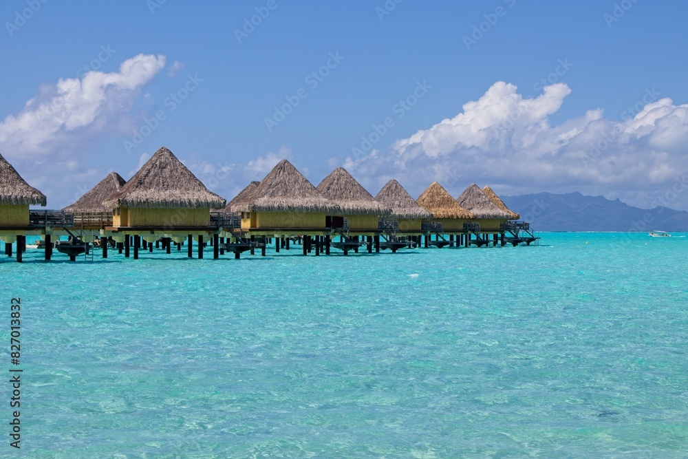Overwater bungalows of the Intercontinental Le Moana sit over crystal clear, warm, pastel-colored waters of Bora Bora Overwater bungalows of the Intercontinental Le Moana sit over crystal clear, warm, pastel-colored waters of Bora Bora