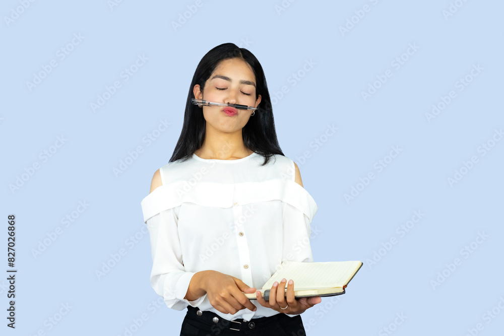 A Young Attractive Nepali Indian Girl Student with Notepad Working Giving Gestures and Expressions A Young Attractive Nepali Indian Girl Student with Notepad Working Giving Gestures and Expressions