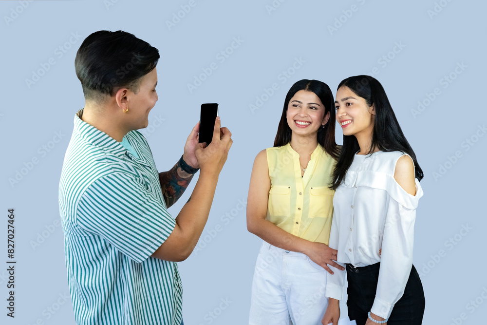 A group of copywriter friends with notepad, mobile phone, laptop giving gestures expresions and working together joyfully A group of copywriter friends with notepad, mobile phone, laptop giving gestures expresions and working together joyfully