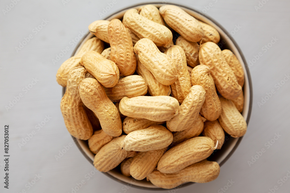 Organic Raw Peanuts in a Bowl, top view. Organic Raw Peanuts in a Bowl, top view.