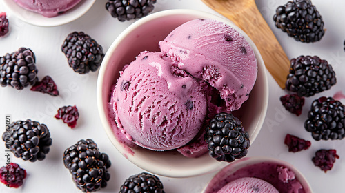 Wide banner photo of delicious scoop of purple color black raspberry chip cookie dough ice cream sorbet on a icecream cup with fruits and chips around in white background  photo