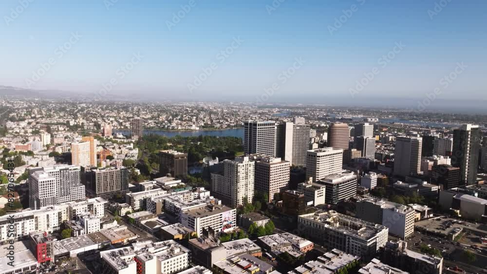 Air over freeway and houses towards skyscrapers in downtown Oakland, California Air over freeway and houses towards skyscrapers in downtown Oakland, California