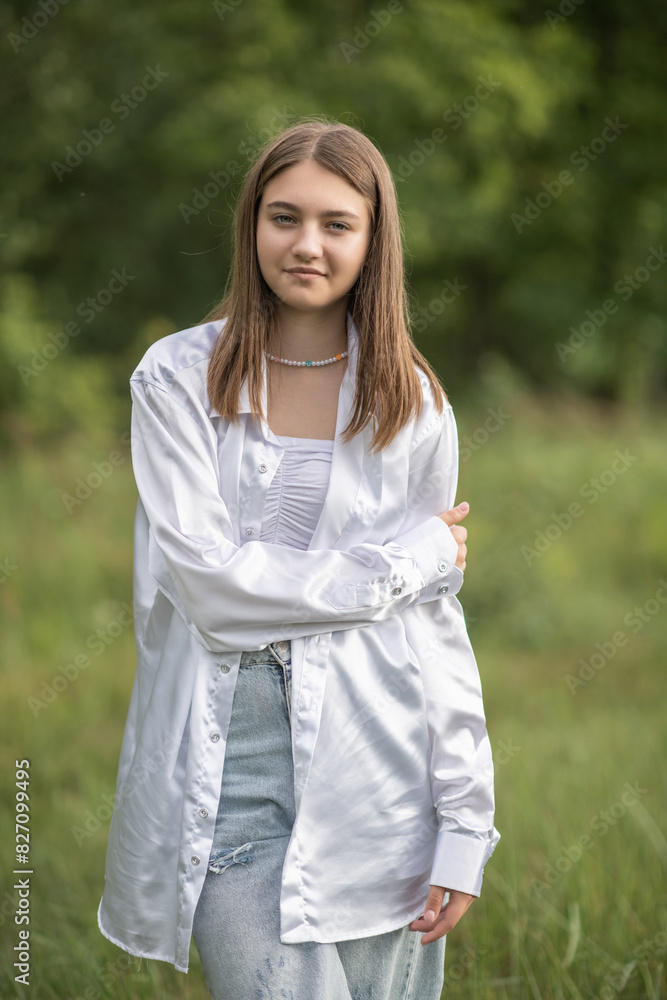 Portrait of a young beautiful long-haired girl outdoors. Portrait of a young beautiful long-haired girl outdoors.
