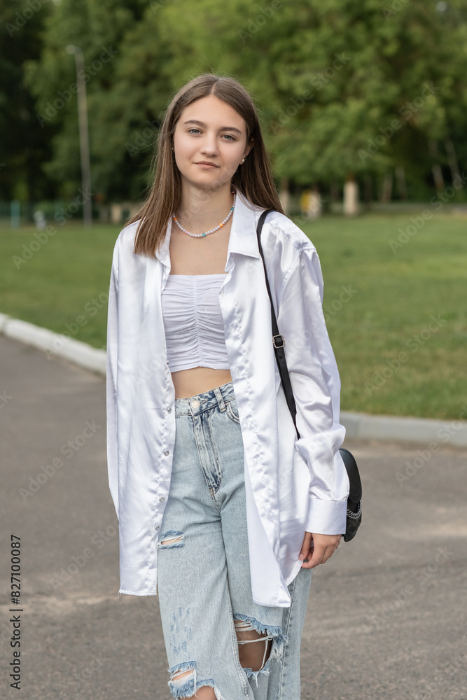 Portrait of a young beautiful long-haired girl outdoors. Portrait of a young beautiful long-haired girl outdoors.
