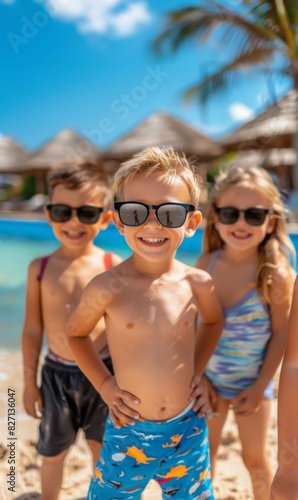 A group of three children standing on a beach in sunglasses. Generative AI. © Natalia