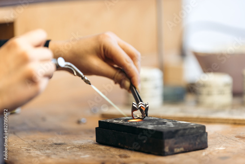 Goldsmith Julia Rosenkranz crafting a ring, showcasing expert artistry photo