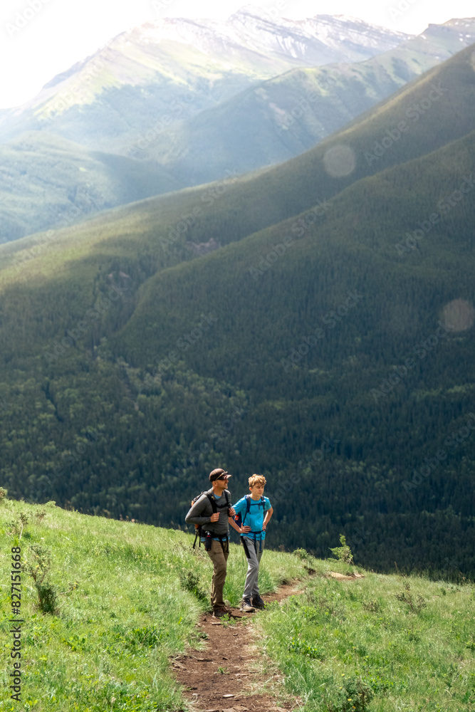 A man and tween hiking in the Canadian Rocky Mountains. A man and tween hiking in the Canadian Rocky Mountains.